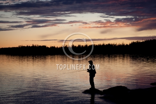 Fisherman silhouette on the beach at colorful sunset 01