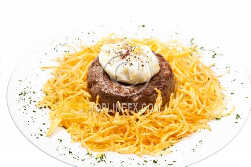 Fried cutlet with chips and egg on white dish