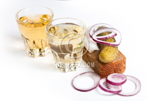 Pepper-brandy in small glass with black bread, pickled, onion and bit of lard